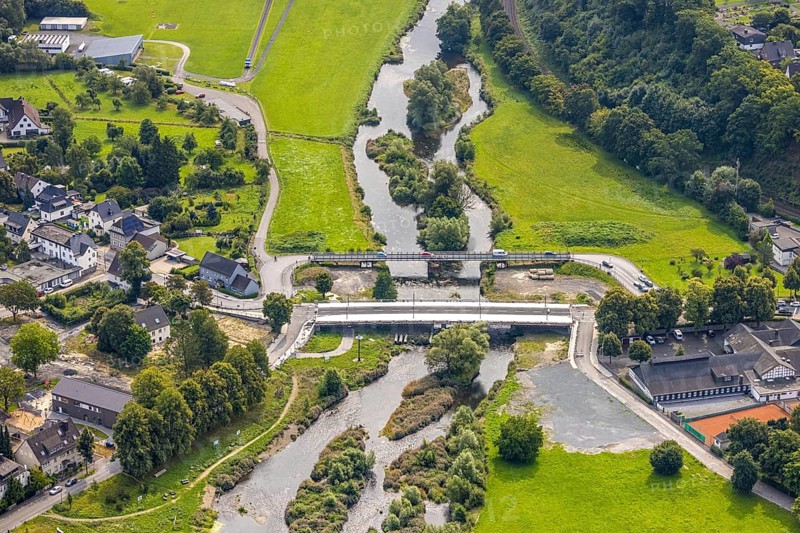 Aerial view, temporary bridge and construction site with new construction of the Dinscheder Ruhrbrücke Glösinger Straße (L735) over the river Ruhr and renaturalisation, Glösingen, Arnsberg, Sauerland, North Rhine-Westphalia, Germany, architecture, construction work, construction area, building site, building plots, construction measure, construction project, construction site, construction site vehicles, temporary bridge, bridge, bridge construction, bridge construction, bridge renovation, DE, Dinscheder Ruhrbrücke, Europe, river, river Ruhr, Glösinger Straße, Hochsauerlandkreis, infrastructure, infrastructure development, engineering, L735, landscape, aerial view, aerial photography, aerial photography, nature, new construction, region, renaturation, Ruhr area, urban development, road construction, technology, overview, environment, traffic, bird's-eye view, water body, birds-eyes view, German city, modern technology, overview, public works