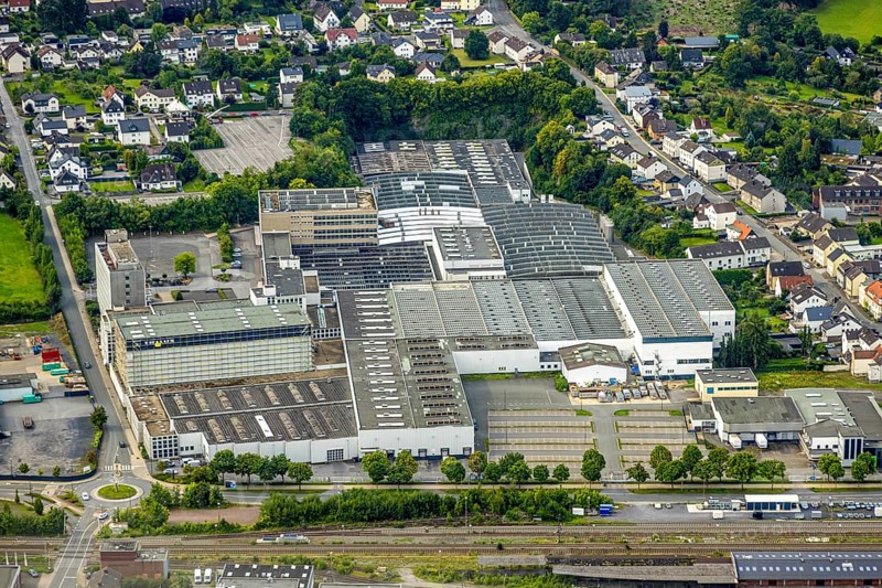 Aerial photo, Trilux GmbH factory lighting manufacturer, Hüsten, Arnsberg, Ruhr area, North Rhine-Westphalia, Germany, DE, Europe, commercial enterprises, commercial area, commercial property, commercial location, commercial use, industrial area, industrial location, aerial photograph, aerial photography, aerial photography, overview, bird's-eye view, birds-eyes view, overview