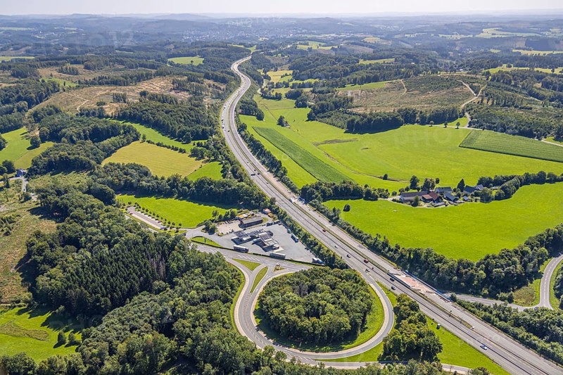 Aerial view, motorway A45 and junction Drolshagen with state road L708, with tankpool24 petrol station, hilly landscape, Germinghausen, Drolshagen, Sauerland, North Rhine-Westphalia, Germany, DE, Europe, aerial view, aerial photography, aerial photography, Ruhr area, road traffic, overview, bird's-eye view, overview