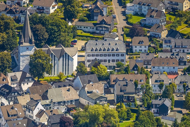 Aerial view, view of the town with St. Clemens-Kirche und Altes Kloster Drolshagen, Drolshagen, Sauerland, North Rhine-Westphalia, Germany, place of worship, DE, Europe, religious community, place of worship, property tax, holy place, real estate, church, parish, monastery, denomination, aerial view, aerial photography, aerial photography, religion, religious site, Ruhr area, overview, bird's eye view, residential area, living and life, residential area, quality of life, residential neighbourhood, housing estate, residential area, birds-eyes view, overview