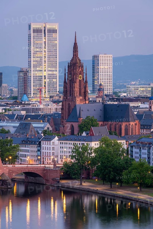 Frankfurt Cathedral, Residential Buildings, Illuminated City and Main River at Morning Twilight. Aerial View. Blue Hour. Hesse, Germany
