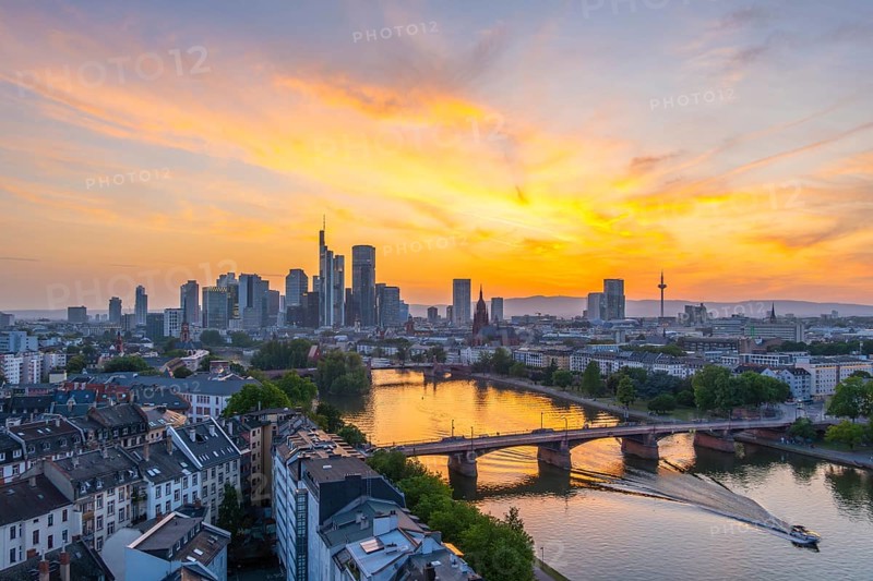 Frankfurt City Downtown, Residential Buildings, Bridges and Main River at Fiery Colorful Sunset. Wide Shot. Aerial View. Golden Hour. Hesse, Germany