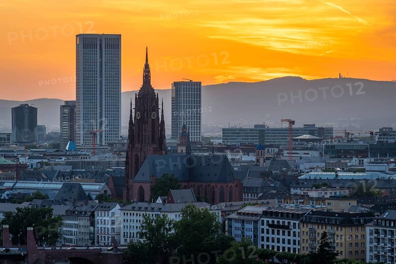 Frankfurt Cathedral, Residential Buildings and City at Fiery Sunset. Aerial View. Golden Hour. Hesse, Germany