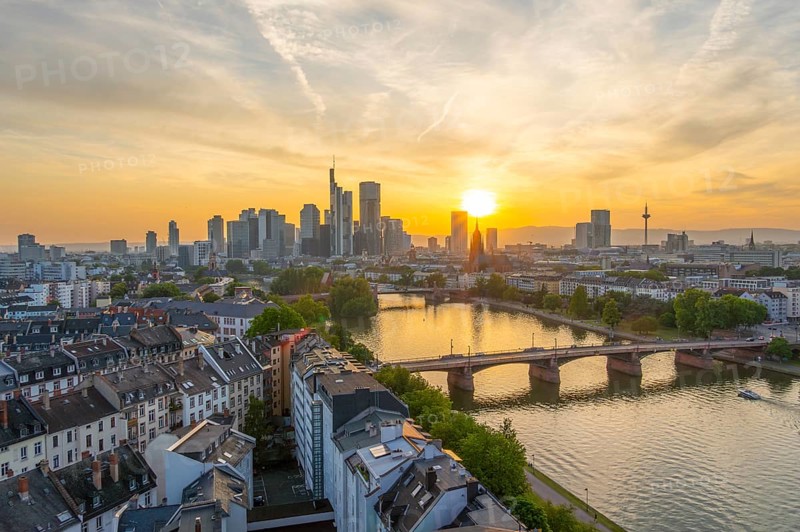 Frankfurt City Downtown, Residential Buildings, Bridges and Main River at Sunset. Wide Shot. Aerial View. Golden Hour. Hesse, Germany