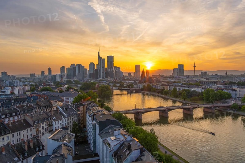 Frankfurt Downtown Skyline, Residential Buildings, Bridges and Main River at Fiery Sunset. Wide Shot. Aerial View. Golden Hour. Hesse, Germany