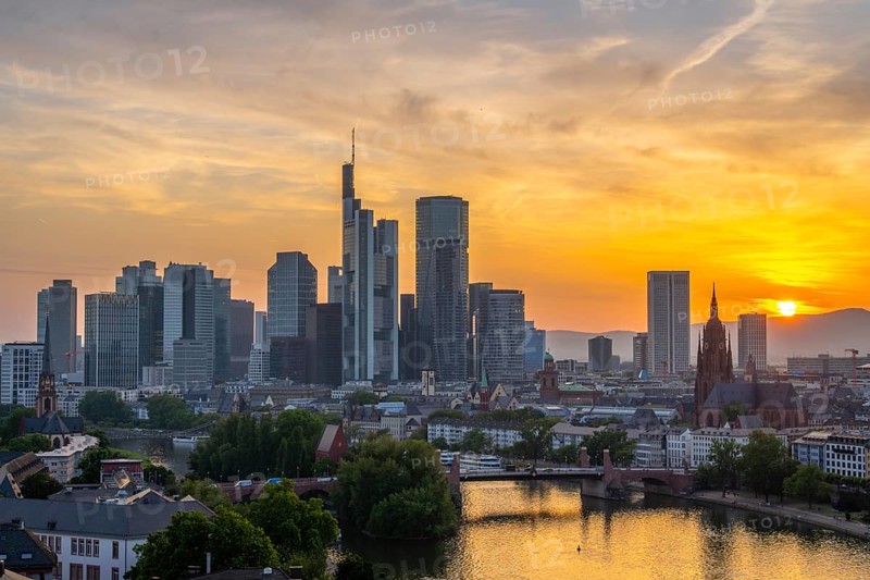 Frankfurt Downtown Skyscrapers, Residential Buildings, Bridges and Main River at Fiery Sunset. Aerial View. Golden Hour. Hesse, Germany