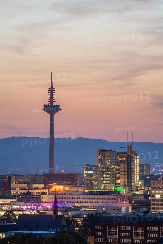 FRANKFURT, GERMANY, JUNE 12, 2025: Illuminated Europaturm Telecommunications Tower in Frankfurt City at Night. Blue Hour. Hesse, Germany