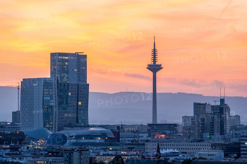 FRANKFURT, GERMANY, JUNE 12, 2025: Europaturm Telecommunications Tower in Frankfurt City at Fiery Sunset. Hesse, Germany