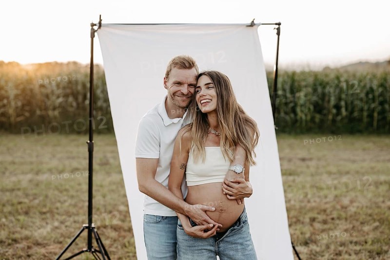 Pregnant, young woman with partner