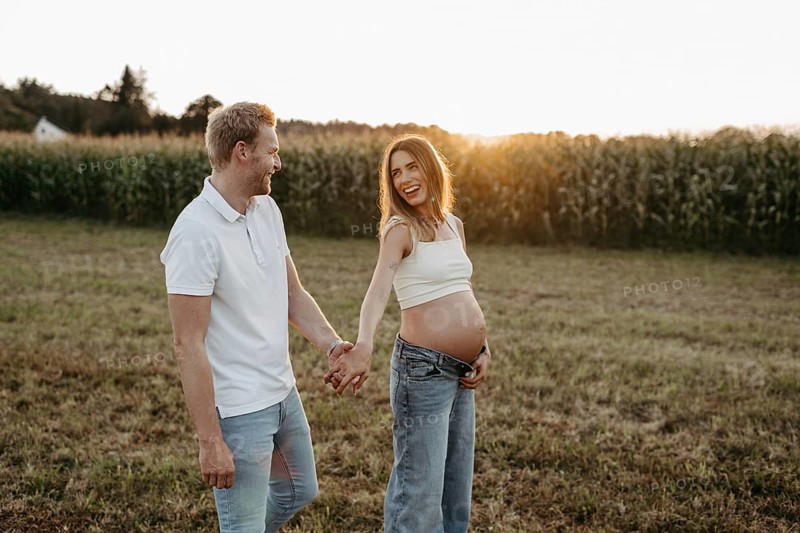 Pregnant, young woman with partner