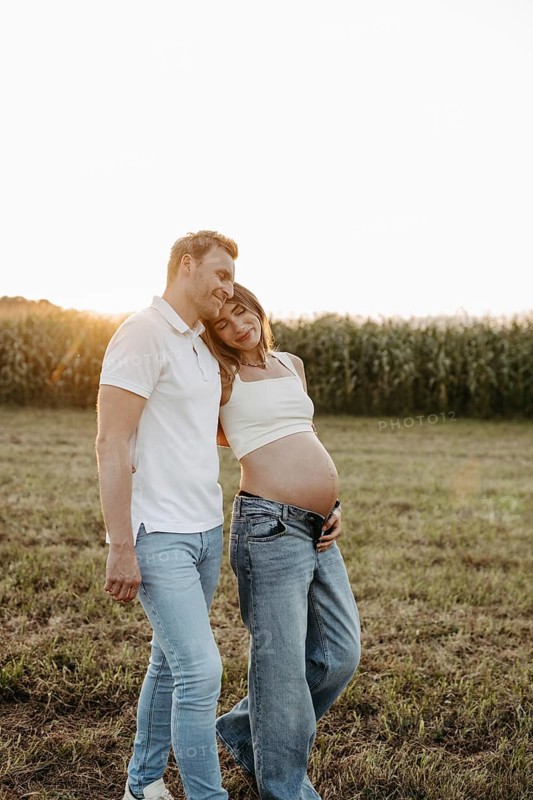Pregnant, young woman with partner