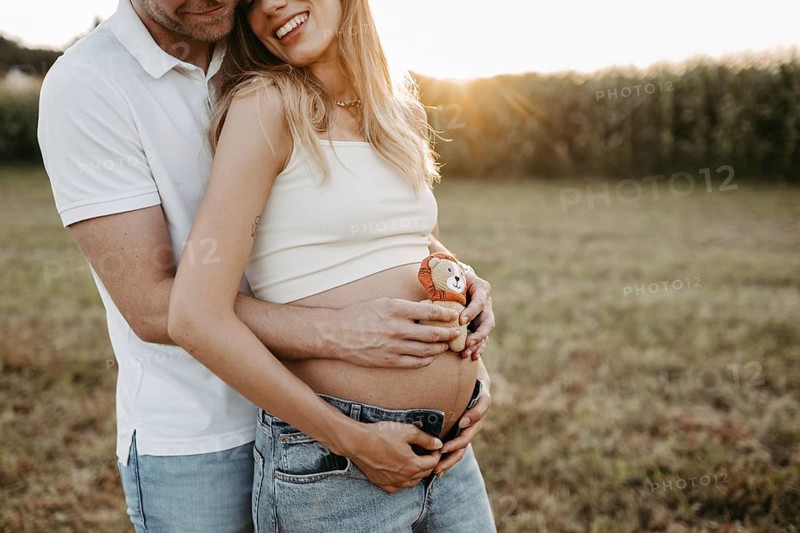 Pregnant, young woman with partner