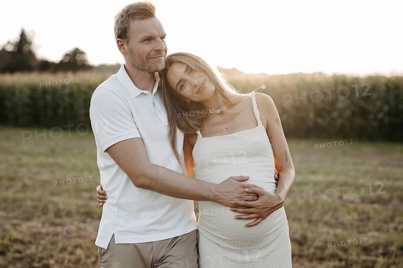 Pregnant, young woman with partner