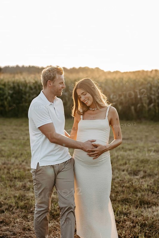 Pregnant, young woman with partner