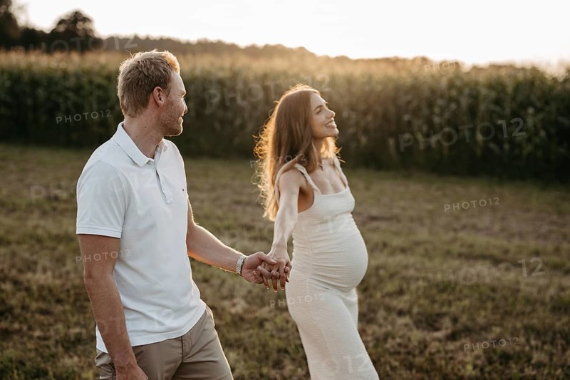 Pregnant, young woman with partner