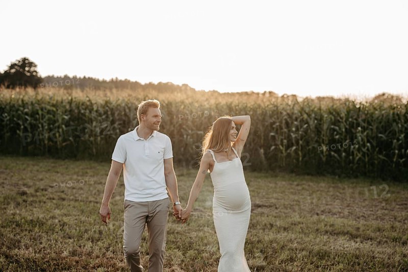 Pregnant, young woman with partner