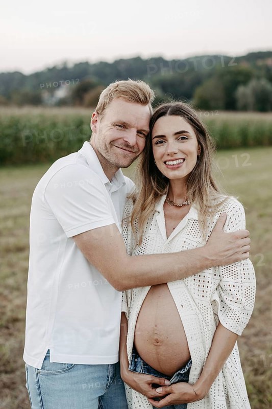 Pregnant, young woman with partner
