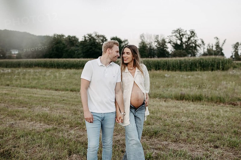 Pregnant, young woman with partner
