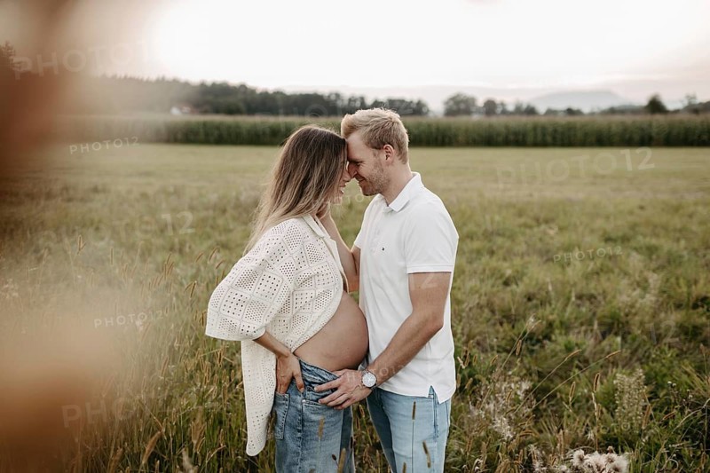 Pregnant, young woman with partner