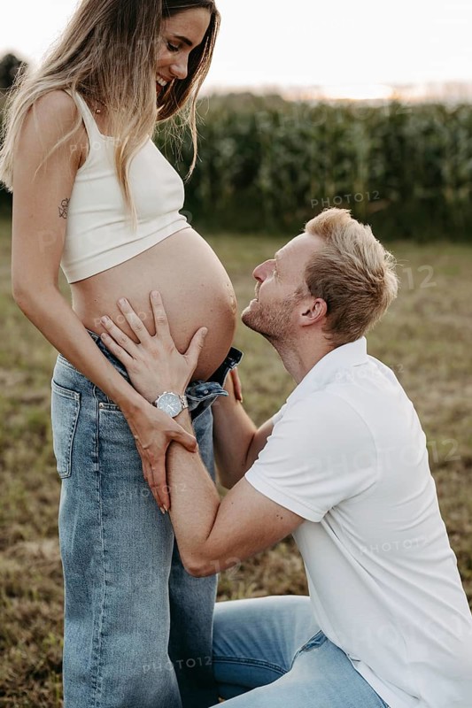 Pregnant, young woman with partner