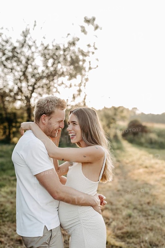 Pregnant, young woman with partner