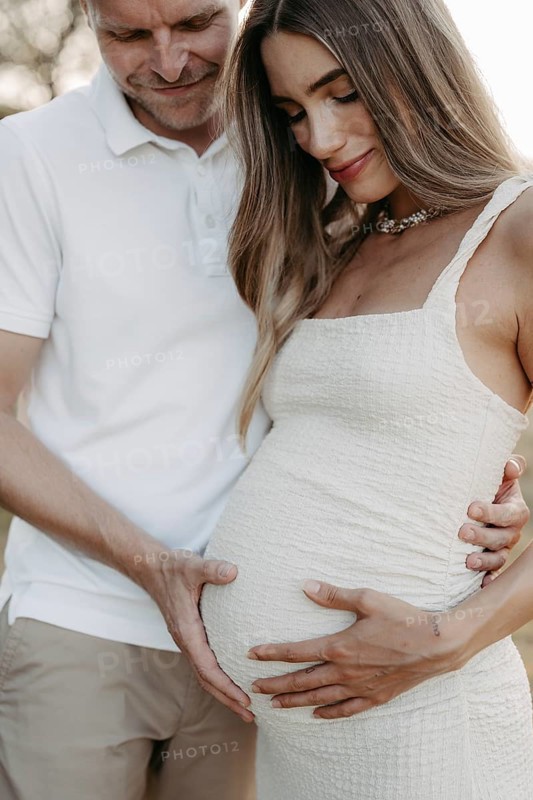 Pregnant, young woman with partner