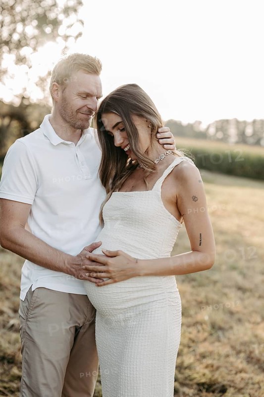 Pregnant, young woman with partner