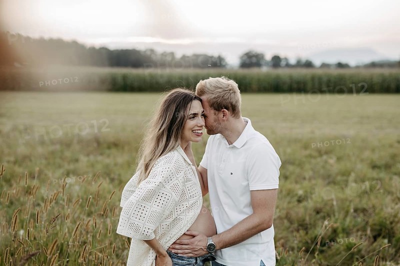 Pregnant, young woman with partner