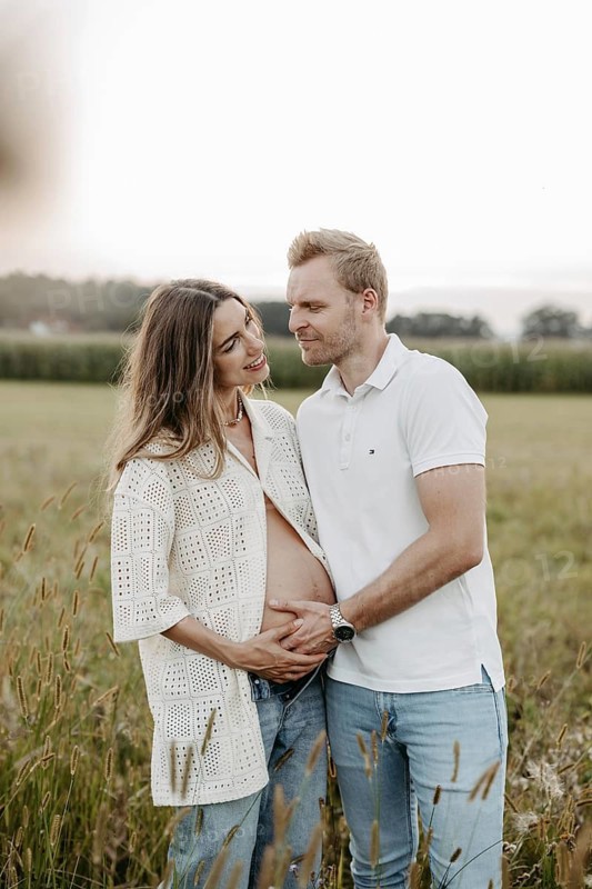 Pregnant, young woman with partner