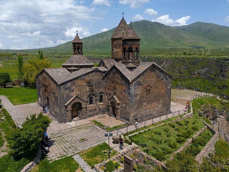 Stone church with natural backdrop and mountain view on paved terrain, aerial view, Saghmosavank Monastery, Saghmosavank, Saghmosavank, Salmosavank, Aragazotn Province, Armenia
