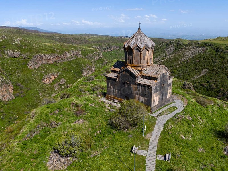 Church on a green hill with a view of a mountain landscape, aerial view, Church of the Mother of God, Vahramashen Church, Vahramashen Surp Astvatsatsin, Church of Amberd, Arkashian Gorge, Aragazotn Province, Armenia