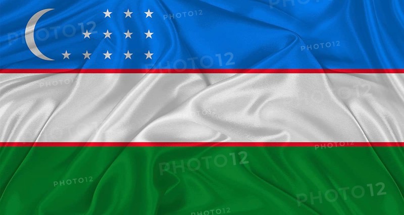 Flag of Uzbekistan with cloth texture. Close up of Uzbekistan flag waving