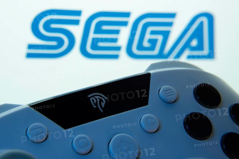 Dhaka, Bangladesh- 13 Sep 2025: A close-up of a gamepad with the Sega seen on screen in the background