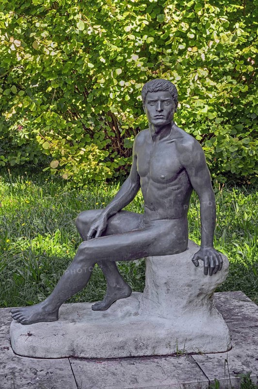 Male sculpture, bronze copy, title Wäcnter, by WLHELM RIEDISSER, in the castle park in Kisslegg, Allgäu, Baden-Württemberg, Germany