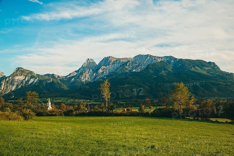 Landscape with green meadow and trees, Admonter Reichenstein group in the background, Weng im Gesäuse, Styria, Austria
