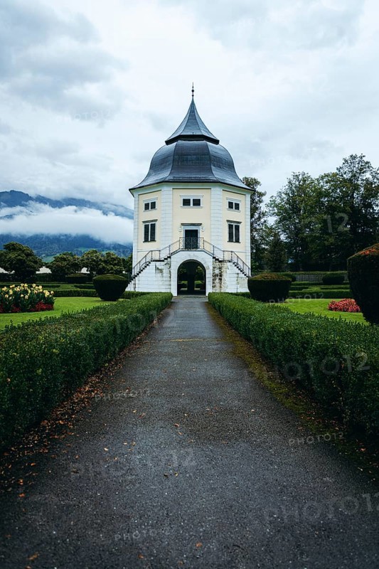 Baroque pavilion in the park of Admont Abbey under a cloudy sky, Admont, Styria, Austria