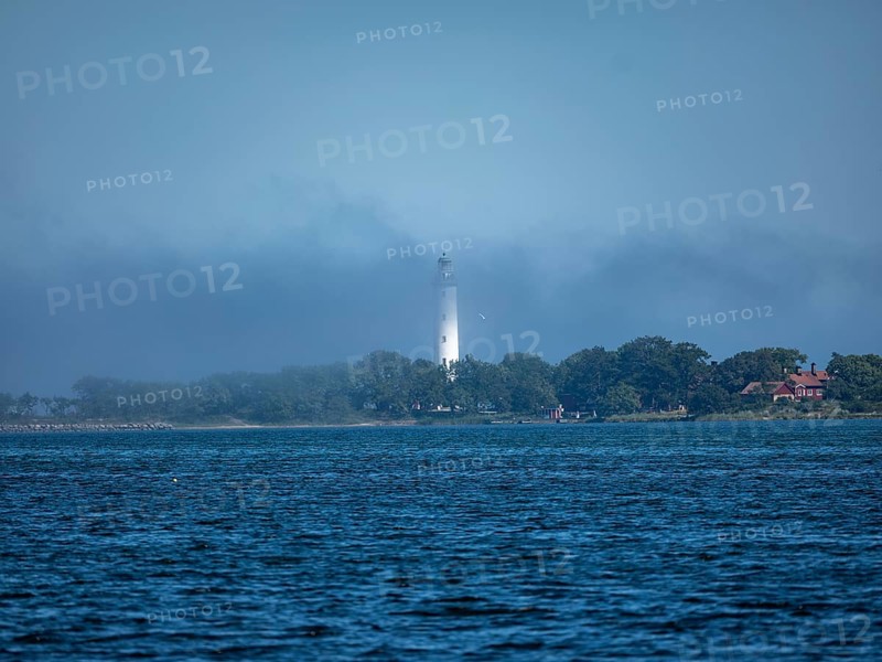 Long Erik lighthouse, Long Erik, on the northern tip of the Swedish island of Stora grundet in the Baltic Sea, in fog, Stora grundet, Öland, Sweden