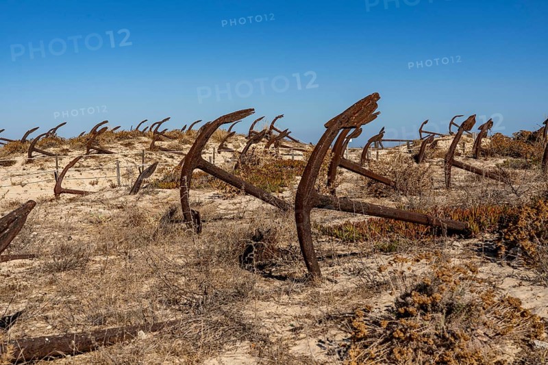 Cemitério das âncoras, anchor cemetery, around 250 iron anchors are placed here, they used to anchor a network of nets on the seabed to catch shoals of tuna travelling along the coast, a reminder of the Algarve's defunct tuna fishery, on Praia do Barril beach on the island of Tavira, Praia da Ilha de Tavira, Algarve, Portugal
