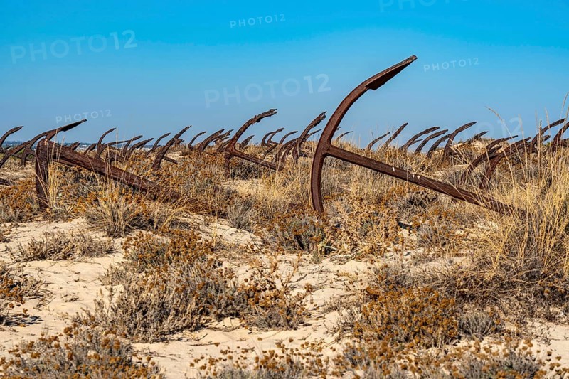 Cemitério das âncoras, anchor cemetery, around 250 iron anchors are placed here, they used to anchor a network of nets on the seabed to catch shoals of tuna travelling along the coast, a reminder of the Algarve's defunct tuna fishery, on Praia do Barril beach on the island of Tavira, Praia da Ilha de Tavira, Algarve, Portugal