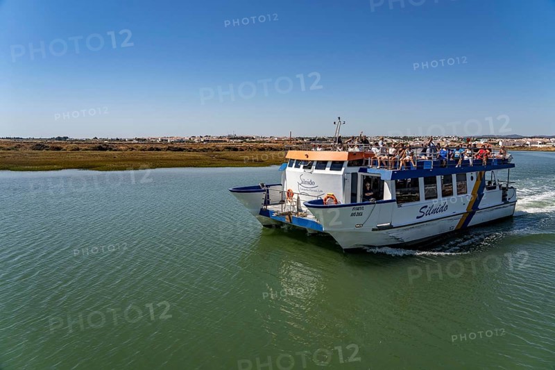 Ride on the Silnido ferry from Tavira on the Gilão River to the beach Praia da Ilha de Tavira, on the island off Tavira, Algarve, Portugal