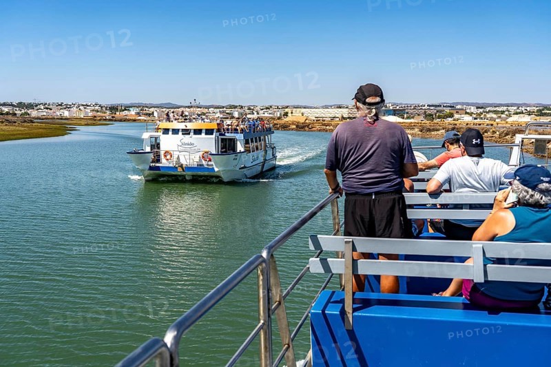 Ride on the Silnido ferry from Tavira on the Gilão River to the beach Praia da Ilha de Tavira, on the island off Tavira, Algarve, Portugal