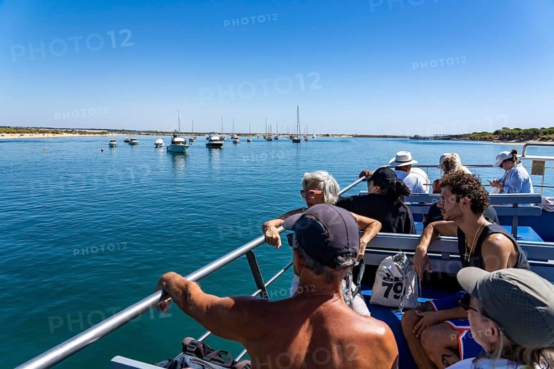 Ride on the Silnido ferry from Tavira on the Gilão River to the beach Praia da Ilha de Tavira, on the island off Tavira, Algarve, Portugal