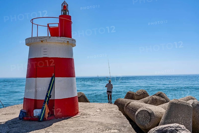 Lighthouse at the kilometre-long beach Praia da Ilha de Tavira, on the island in front of Tavira, port lighthouse to the harbour entrance, Algarve, Farol de Tavira Molhe Öste, Portugal