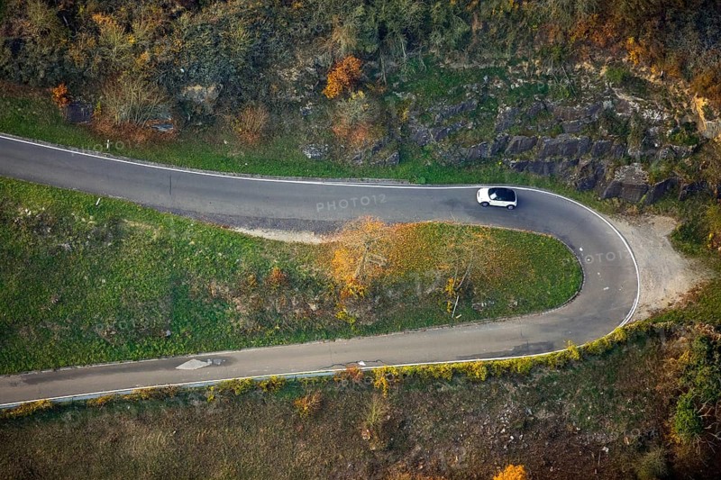 Serpentine roads in the vineyards of Oberwesel near Loreley, Rhine valley, Rhine wine, colourful vine leaves, Golden October, Oberwesel, Rhine-Hunsrück district, Rhineland-Palatinate, Germany, Europe, aerial view, birds-eyes view, aerial photography, aerial photography, overview, bird's eye view