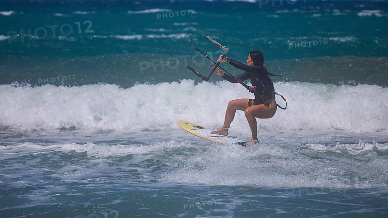 Photo of a kitesurfer jumping over the waves of the ocean, Prasonisi, beach, surf, windsurfer, kite surfer, waves, south coast, Rhodes, Dodecanese, Greek Islands, Greece