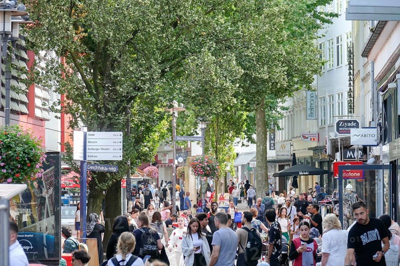 Pedestrian zone and shopping street Lüneburger Straße with many people and shops, Harburg, Hamburg, Germany