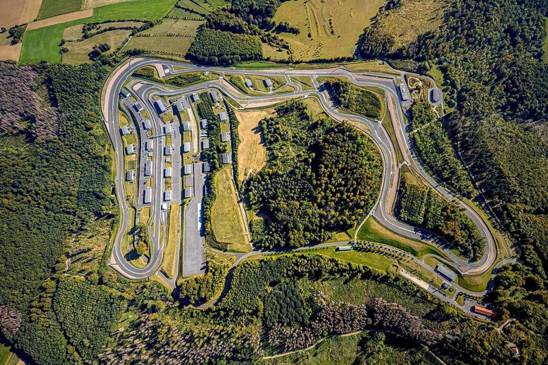 Aerial view, Bilster Berg race track, paddock, racing cars, Pömbsen, Bad Driburg, East Westphalia-Lippe, North Rhine-Westphalia, Germany, racetrack, Bilster Berg, pit halls, DE, Europe, aerial view, aerial photography, aerial photography, motorsport, OLWBUCH, OWL, OWL-Buch, East Westphalia, racing, race track, circuit, overview, bird's-eye view, forest area, birds-eyes view, overview