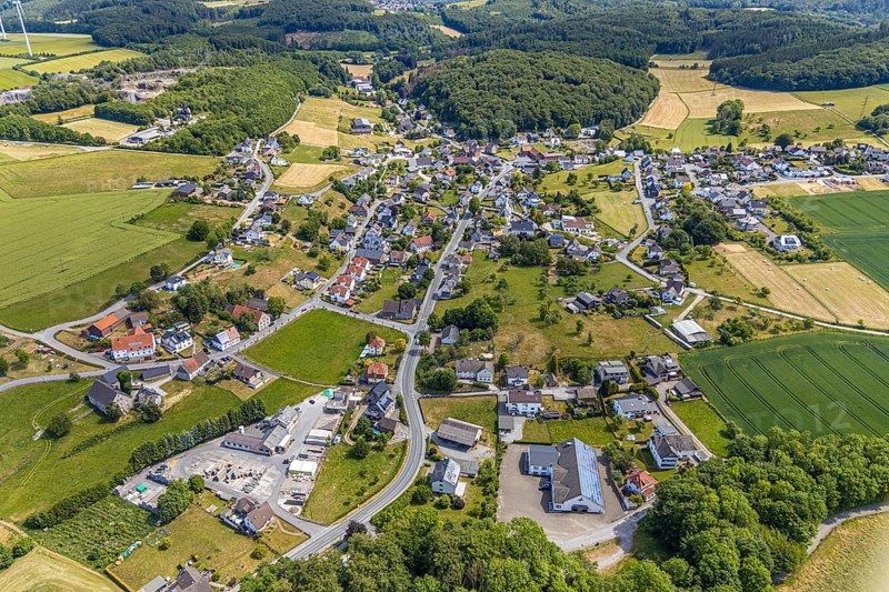 Aerial view, local view district Beckum, catholic church St. Nikolaus, Balve, Sauerland, North Rhine-Westphalia, Germany, place of worship, federal road B229, DE, Europe, religious community, place of worship, property tax, real estate, church, parish, denomination, aerial view, aerial photography, aerial photography, overview, bird's eye view, forest area, living and life, residential area, residential buildings, residential quality, housing estate, birds-eyes view, overview