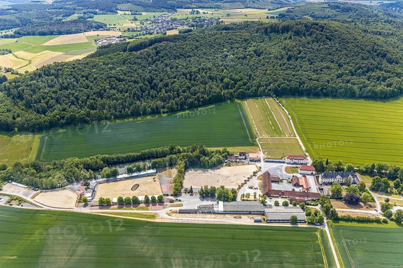 Aerial view, equestrian centre Reiterverein Balve, Schloss Wocklum, Balve, Sauerland, North Rhine-Westphalia, Germany, DE, Europe, manor house, manor house, manor building, courtyard, aerial view, aerial photography, aerial photography, horses, equestrian sports, equestrian centre, riding stable, riding club, riding stable, castle, castle garden, overview, defence system, bird's eye view, forest area, moated castle, moated castle, meadows and fields, Wocklum, birds-eyes view, overview