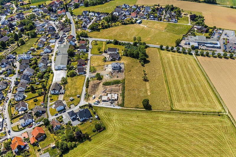 Aerial view, construction site residential buildings Kurze Straße, Opel car dealership Carl Bichmann, Aral petrol station, Balve, Sauerland, North Rhine-Westphalia, Germany, construction work, construction area, building site, building plots, construction project, construction site, DE, Europe, shapes and colours, aerial view, aerial photography, aerial photography, new building, Schramm & Verbecke oHG manufacturer, overview, bird's-eye view, overview, Langenholthausen